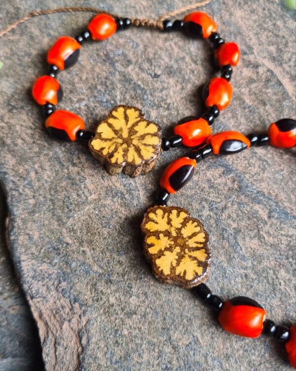 Black Ayahuasca slice and Huayruro seed bracelet